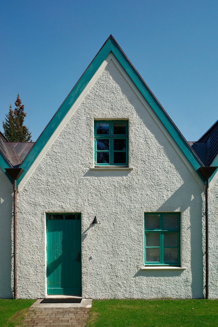 Rough-cast stucco exterior on a gabled house